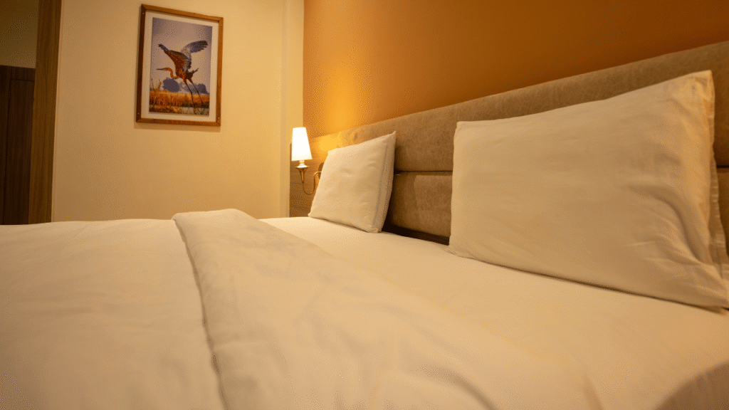 Bed in Deluxe room - Golden Pagoda ecoresort - best resort in Namsai